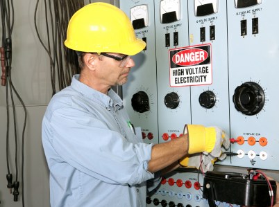 JNH Electric LLC industrial electrician working with high voltage.